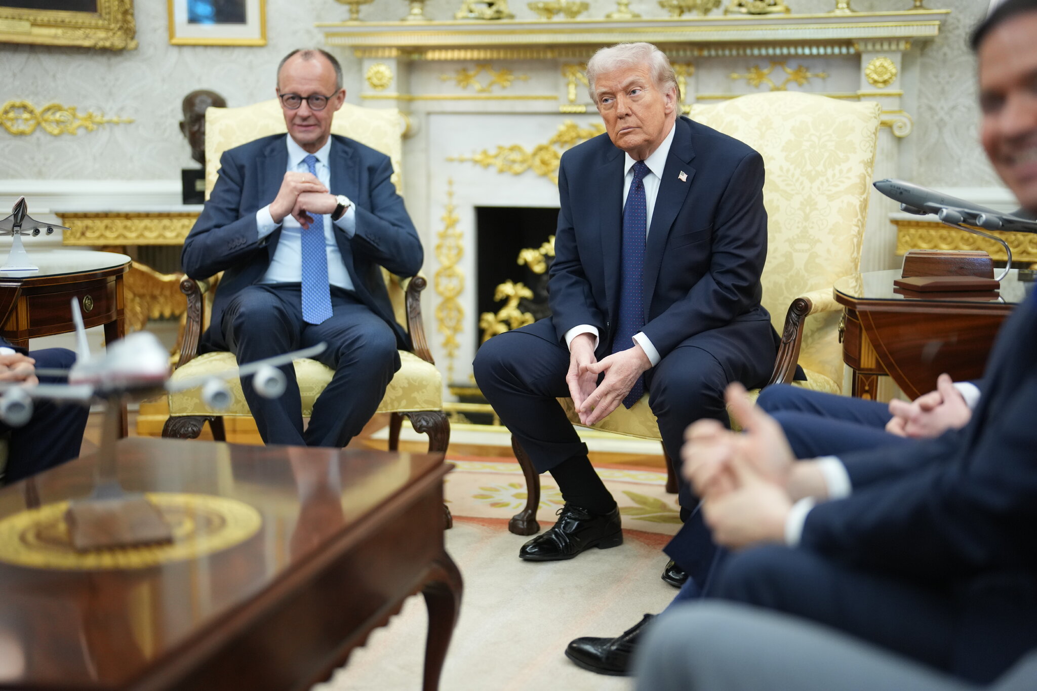 As Trump Bashes Spain, the German Chancellor Looks On