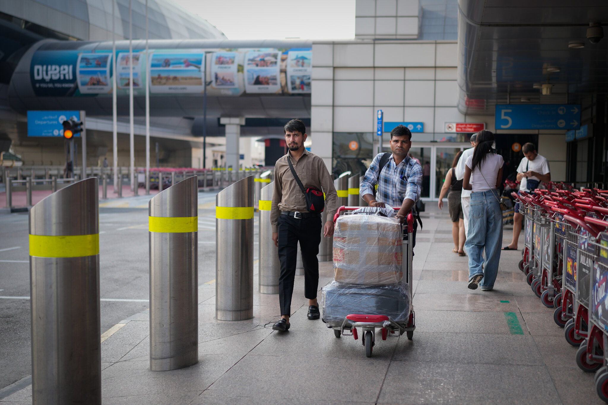 Desperate travelers wait as Dubai resumes a few flights.