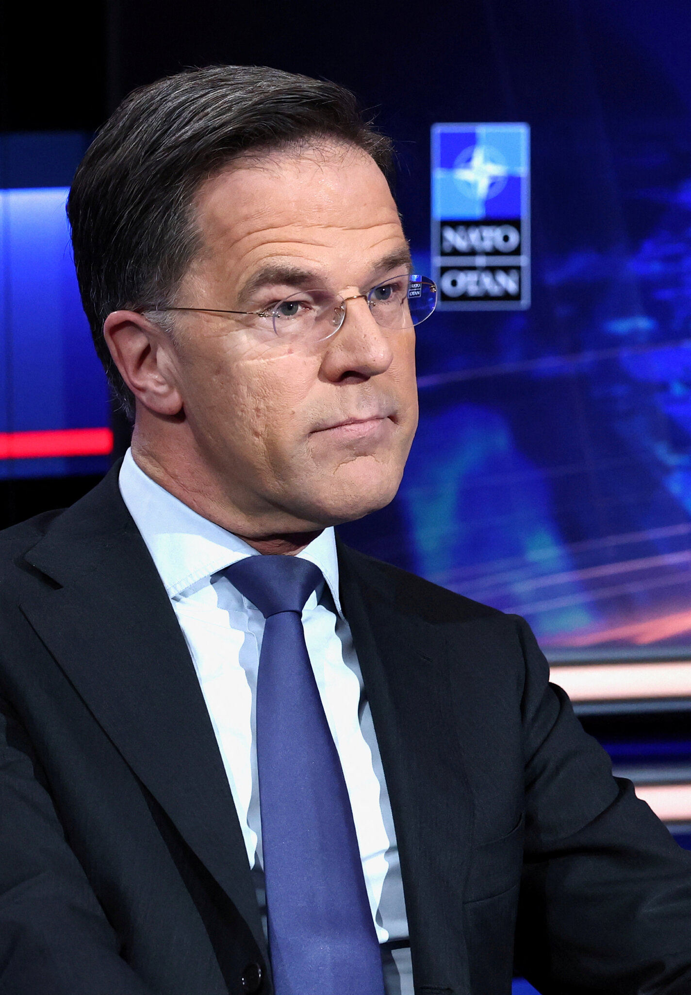 NATO’s chief downplays the risks that the alliance will be drawn into the conflict.