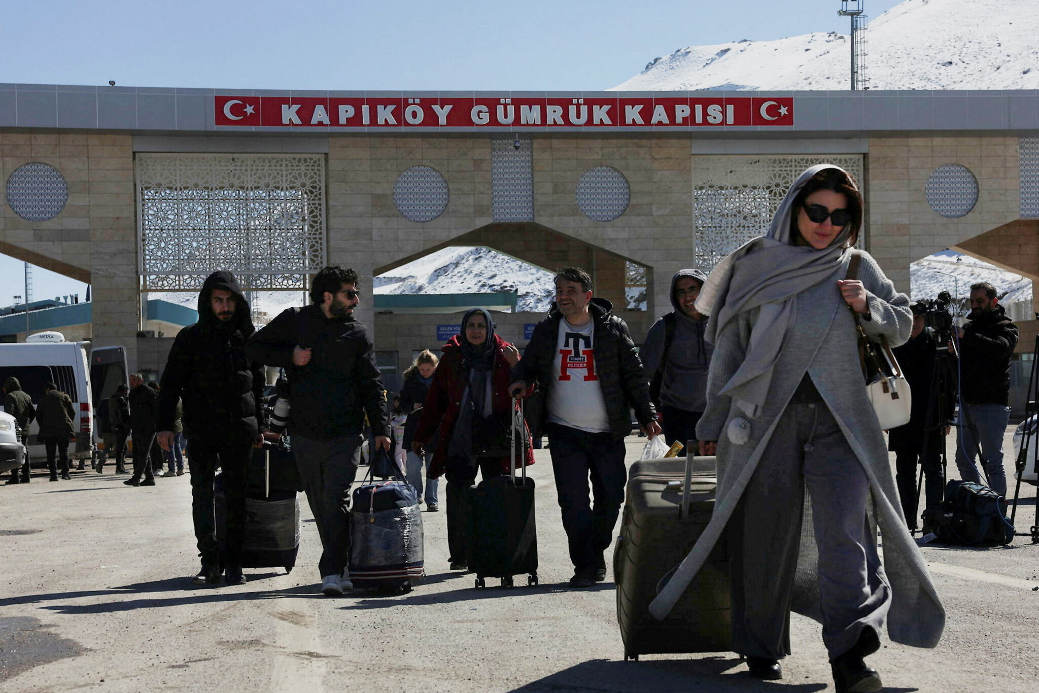 Fueled by anxiety, exhausted Iranians cross the border into Turkey.