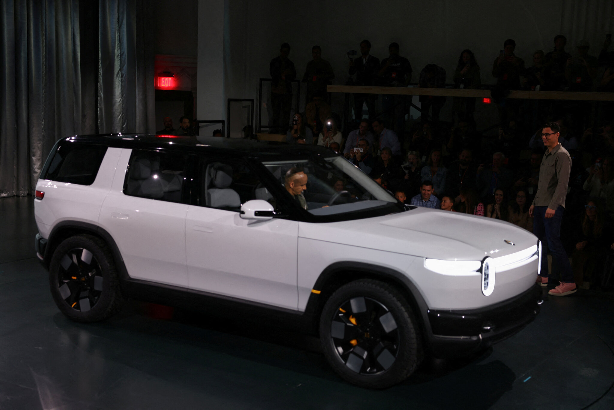 Uber to Buy Rivian Vehicles for Use as Driverless Taxis