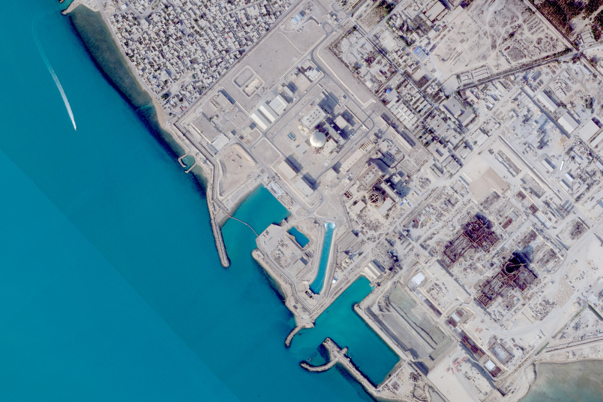 A projectile hit near Iran’s Bushehr nuclear plant, killing a worker.
