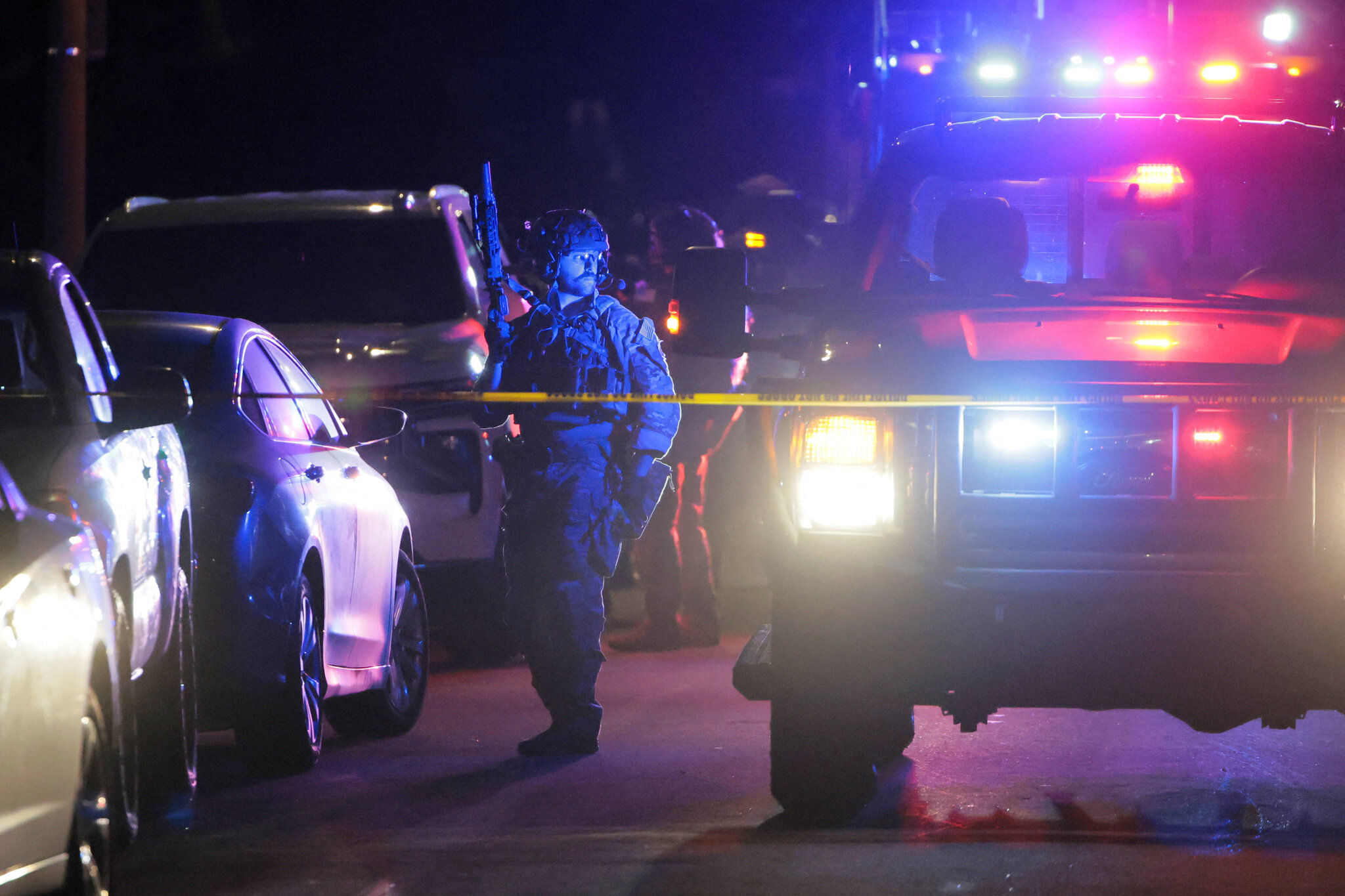 Federal authorities swarm the suspect’s home in an L.A. suburb.
