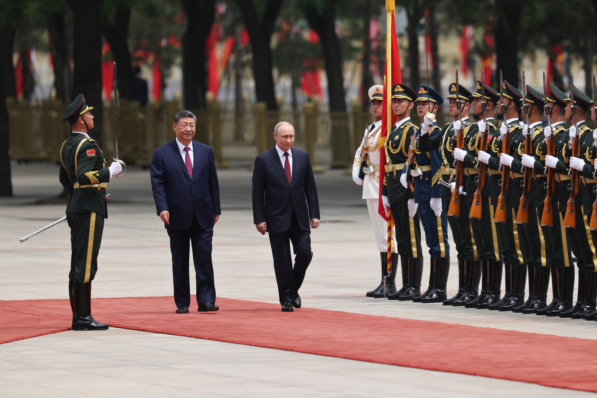 Days After Hosting Trump, Xi Deepens Ties With Putin