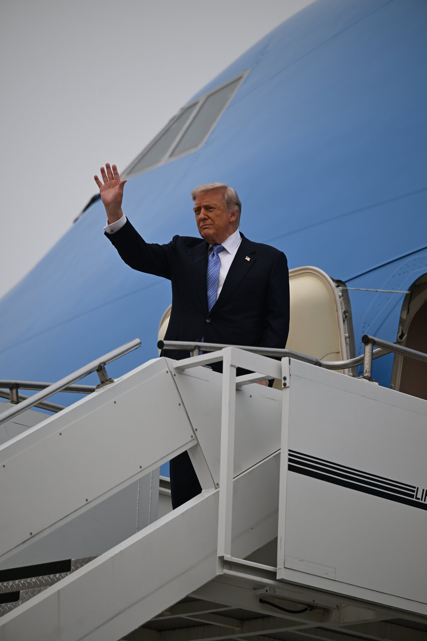 From Air Force One, Trump writes of ballrooms, a statue and TikTok.