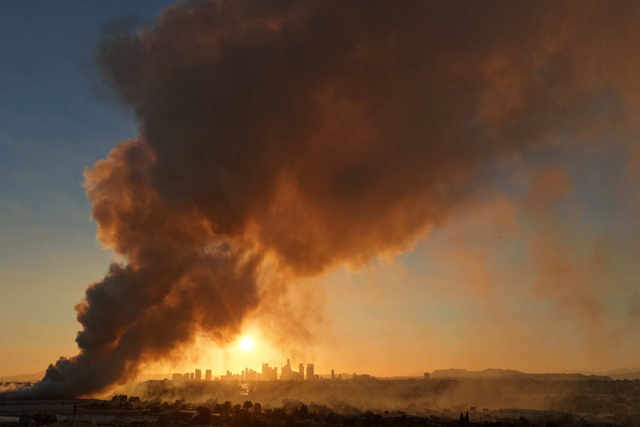 Dark Smoke in a Sunny Place: Neighbors of L.A. Fire Struggle for Breath
