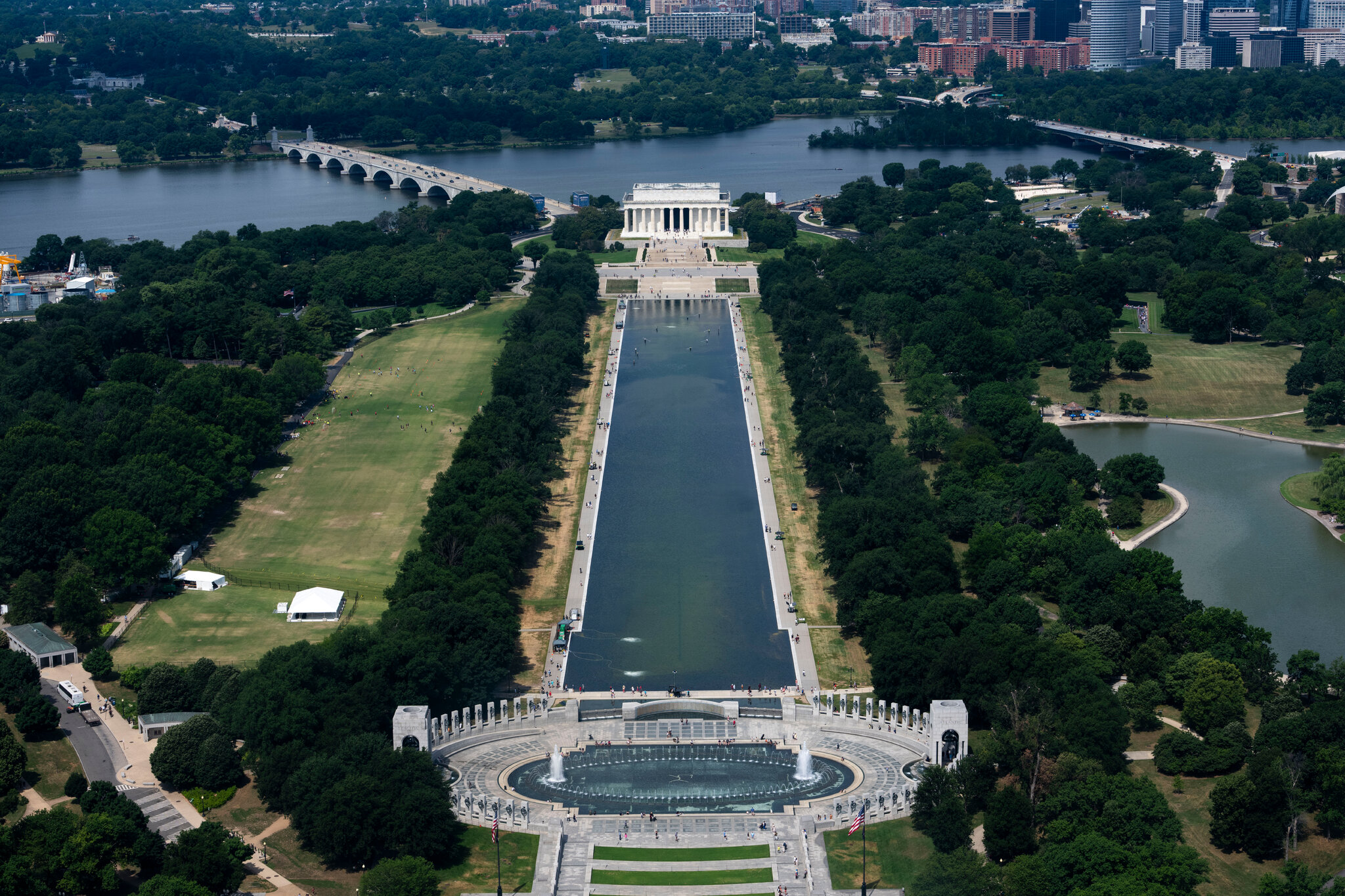 Visitors Look at the Reflecting Pool and Disagree on What They See
