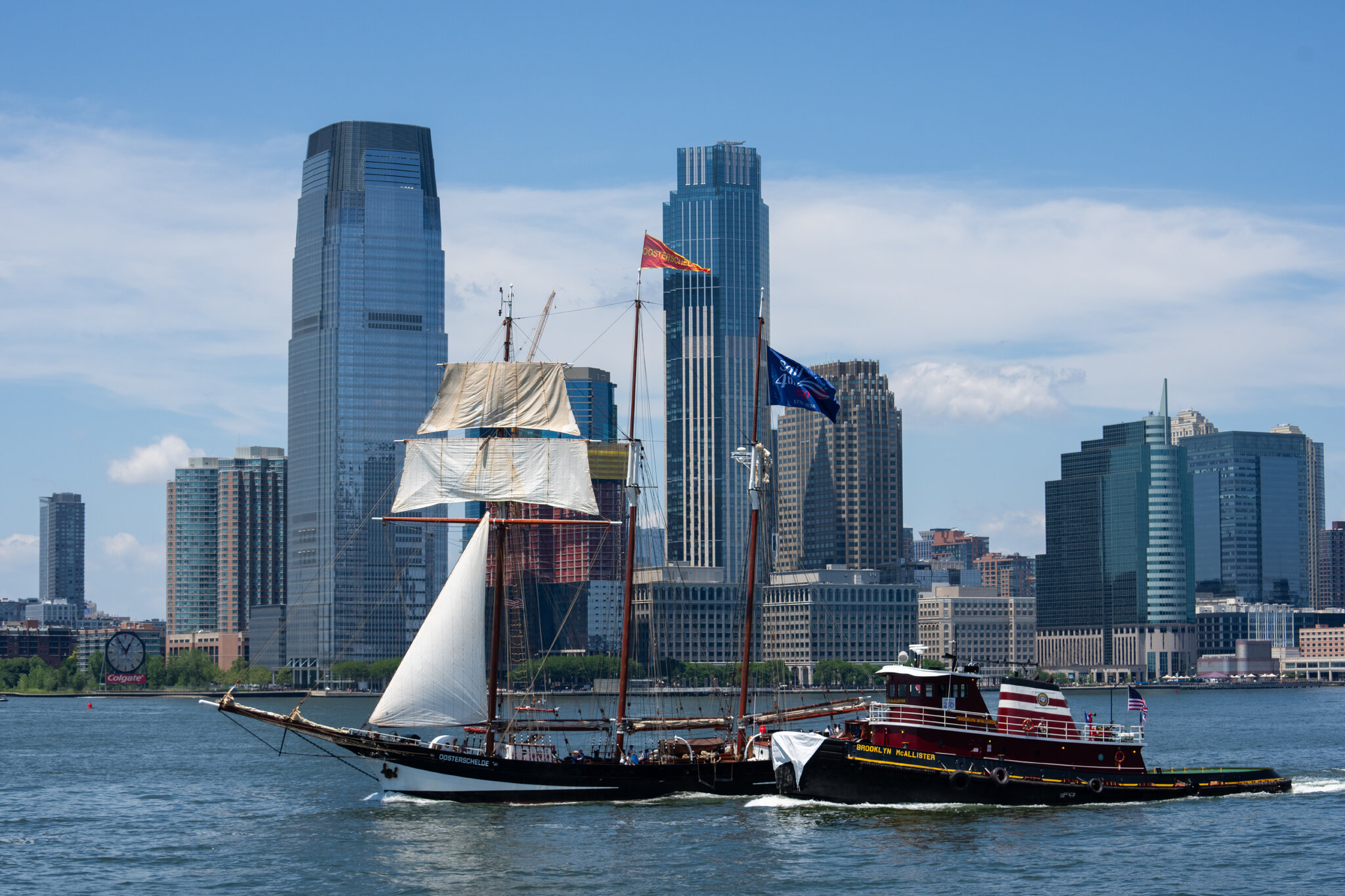 Watching the tall ships parade from a small tugboat.