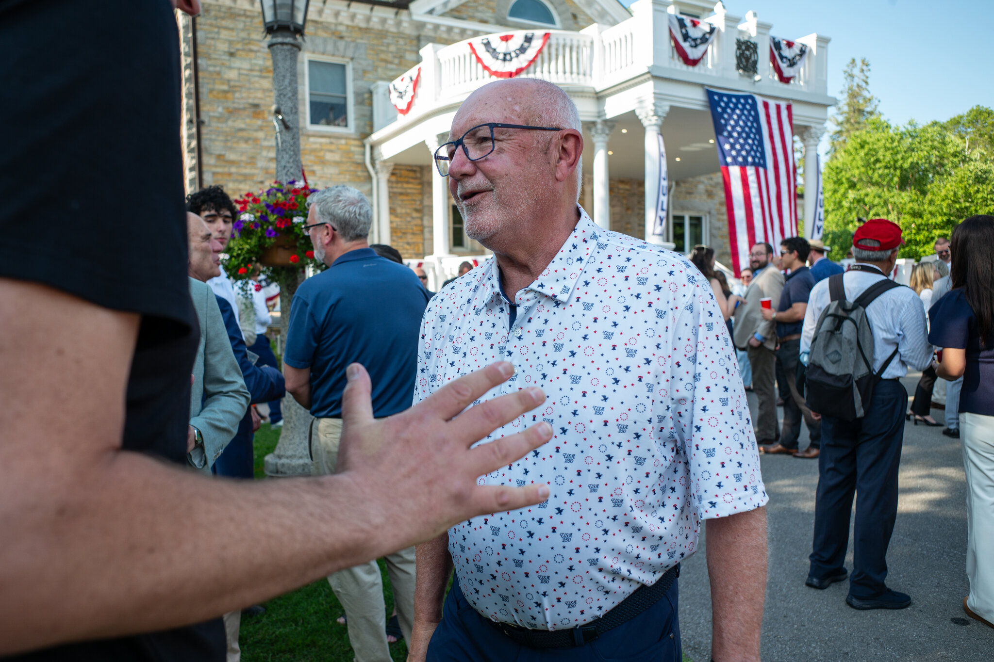 The U.S. ambassador to Canada hosts a July 4 party amid tension over a new bridge.