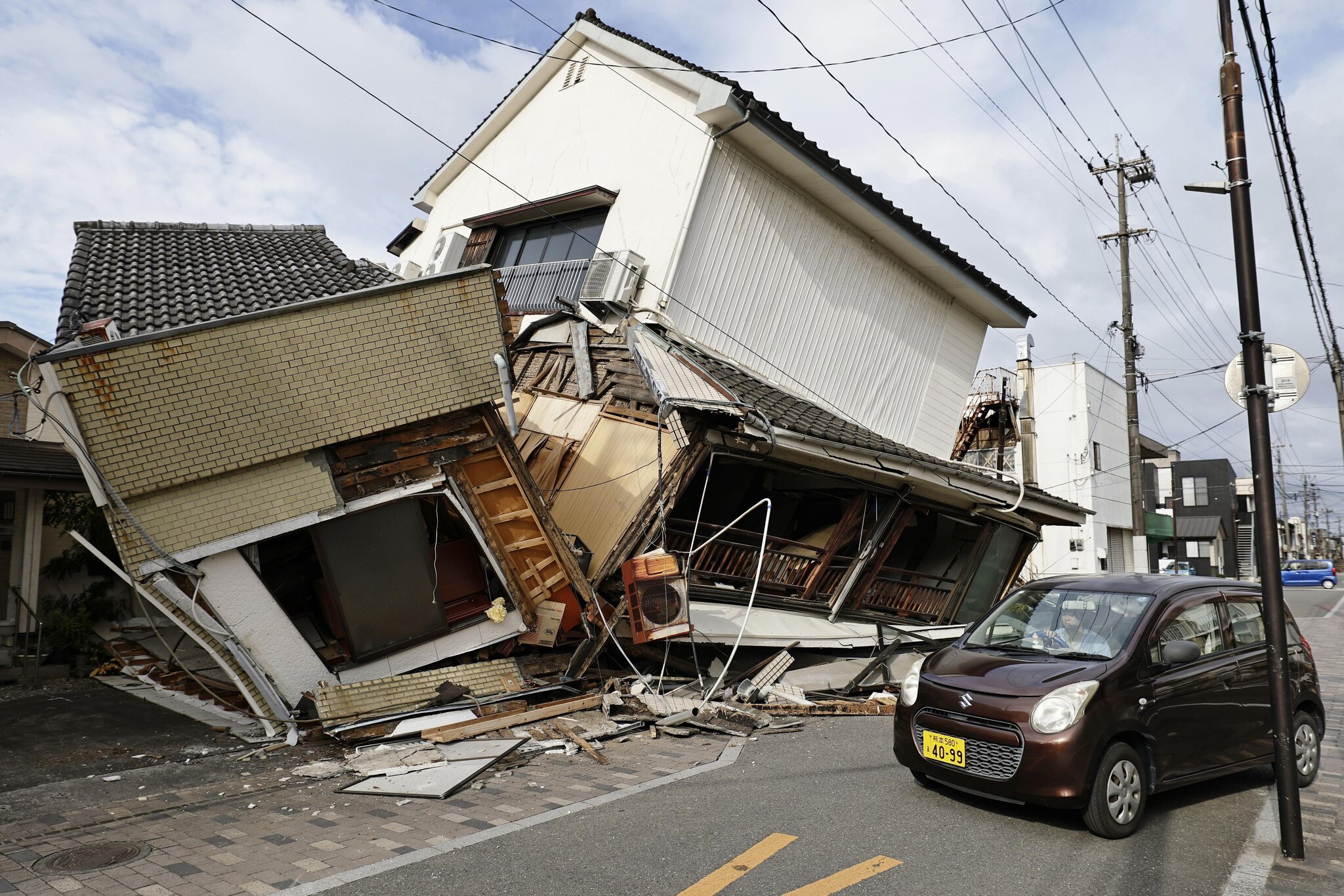 Japan Races to Reach People Trapped After Earthquake Kills at Least 13