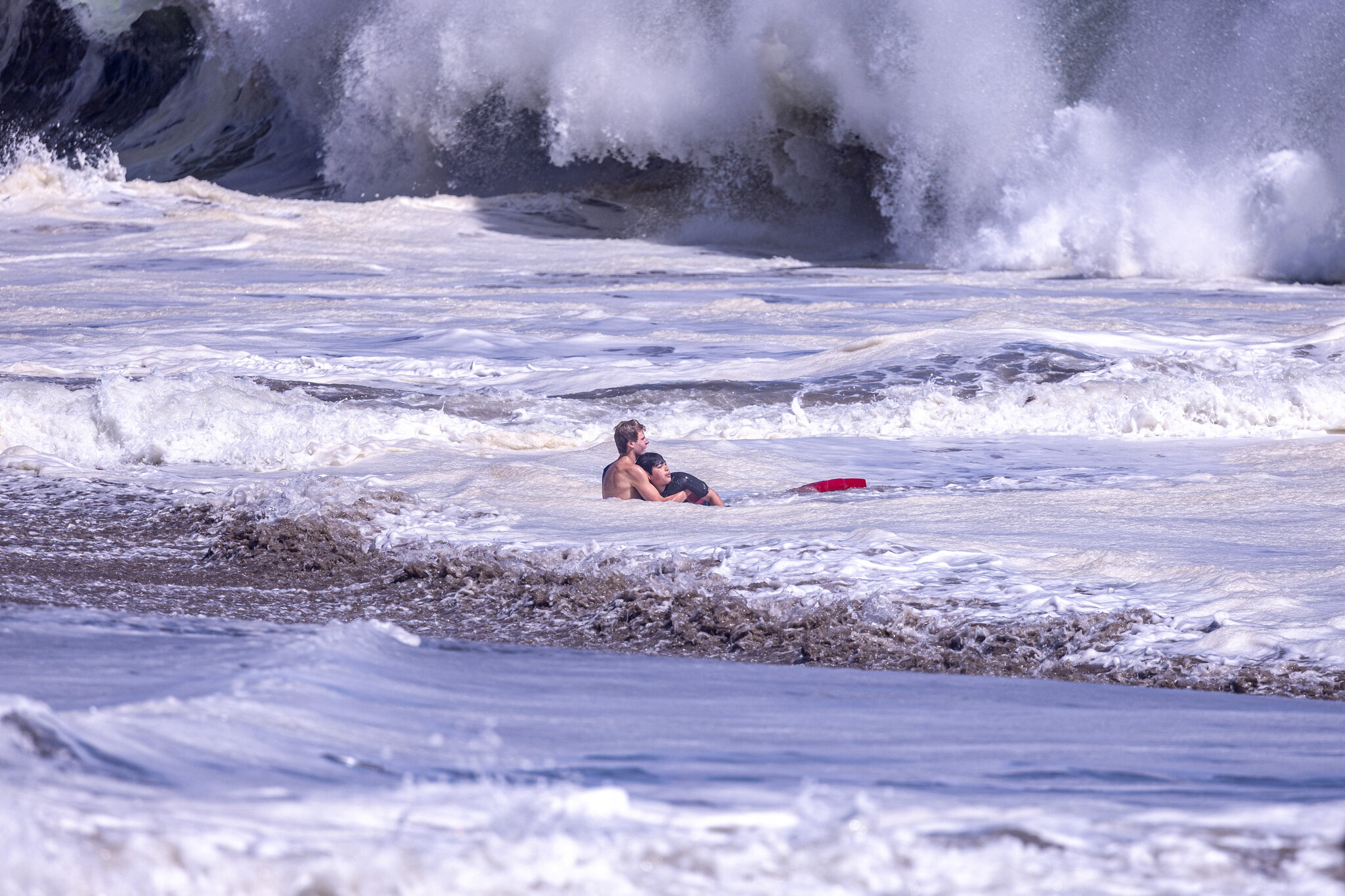 Teenage Lifeguard Fights Intense Waves to Bring Boy to Safety